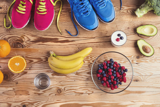 38364135 - running shoes and healthy food composition on a wooden table background