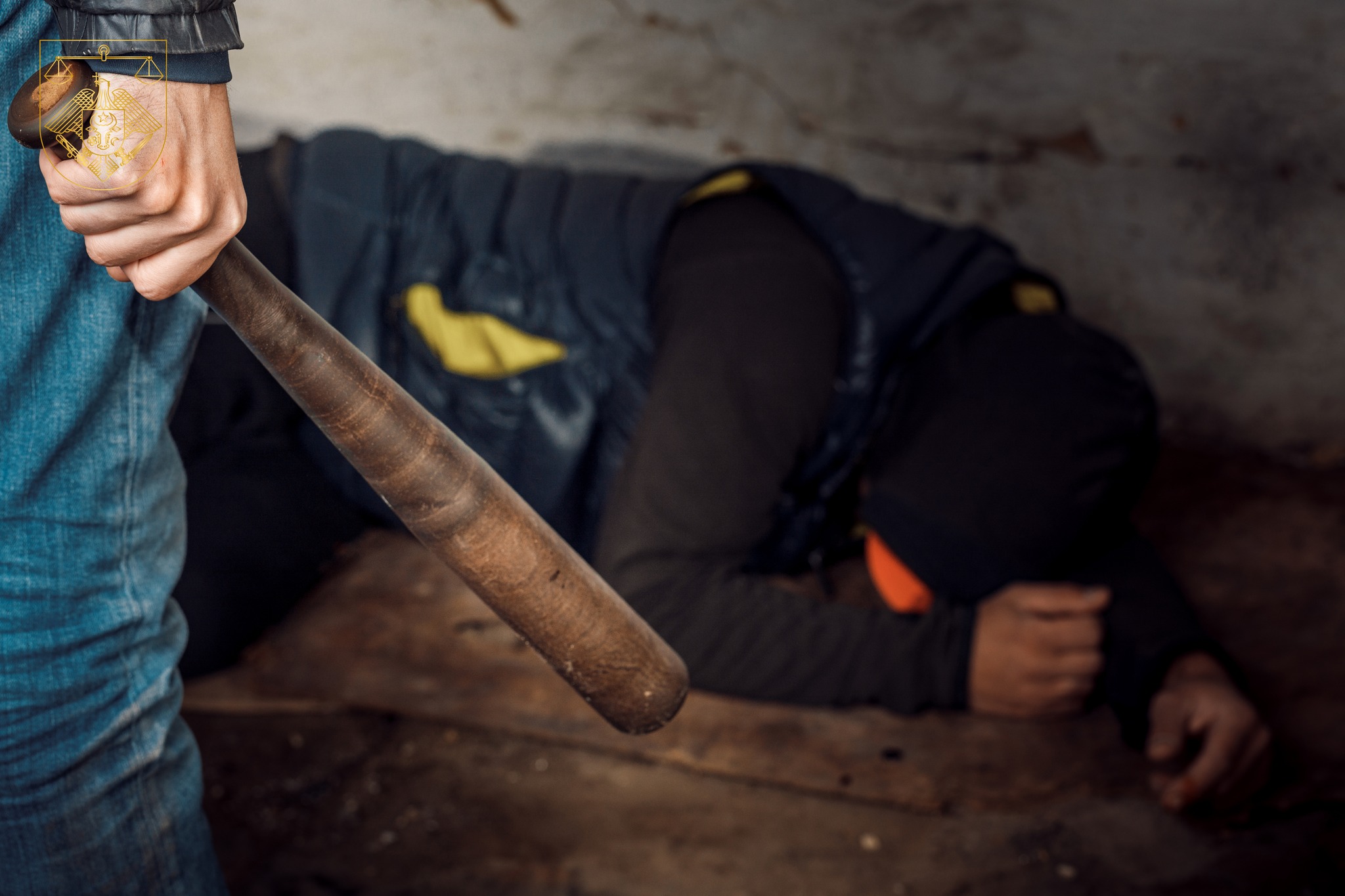 An evil kidnapper beats the victim with a baseball bat. The concept of crime and murder.