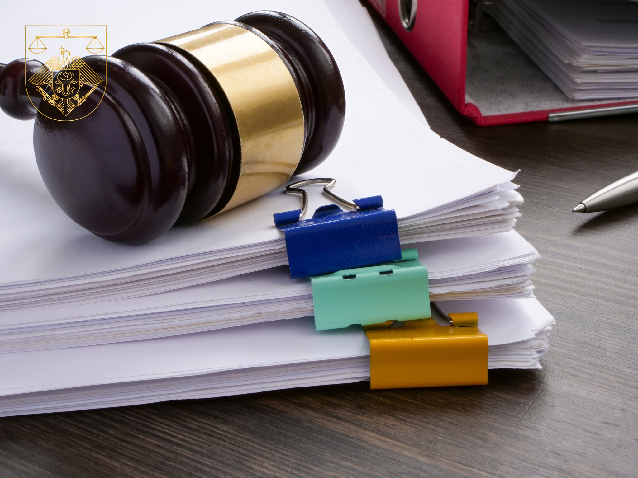 A stack of accounting papers and gavel. Financial white-collar crime and embezzlement.