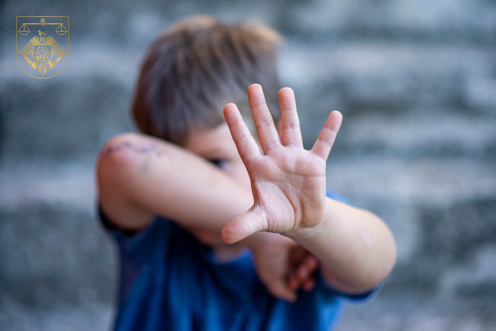 Children violence and abused concept. Child raising hands to protect itself.