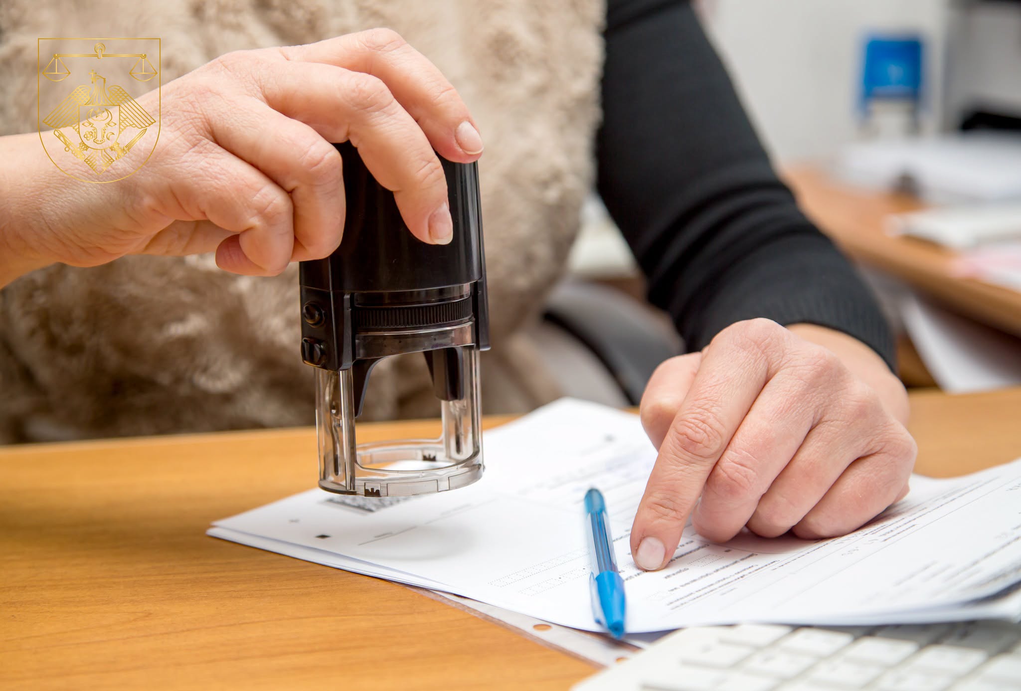 female hand with stamp prepare to execute print